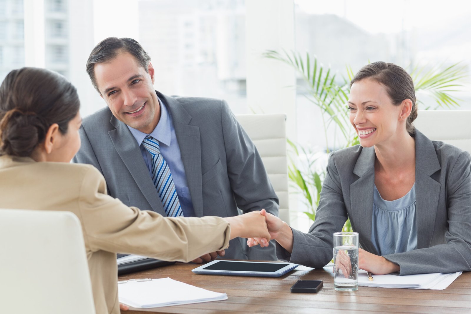 business people conducting an interview in an office business people conducting an interview in an office